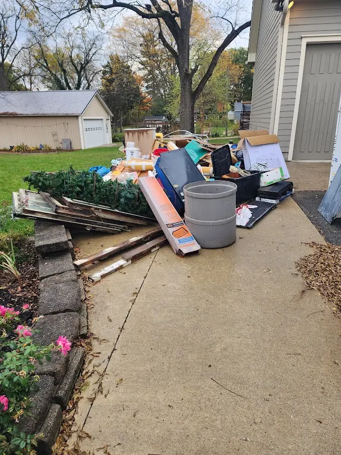 Dumpster being loaded with debris for 30 Yard Dumpster Rental in Jenks